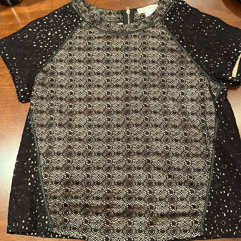 Medium, black lace and nude top, “leather”piping detail